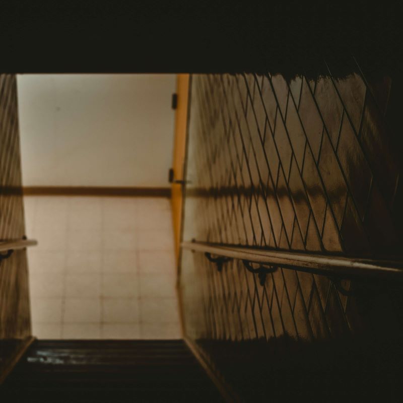 Dark staircase leading to basement